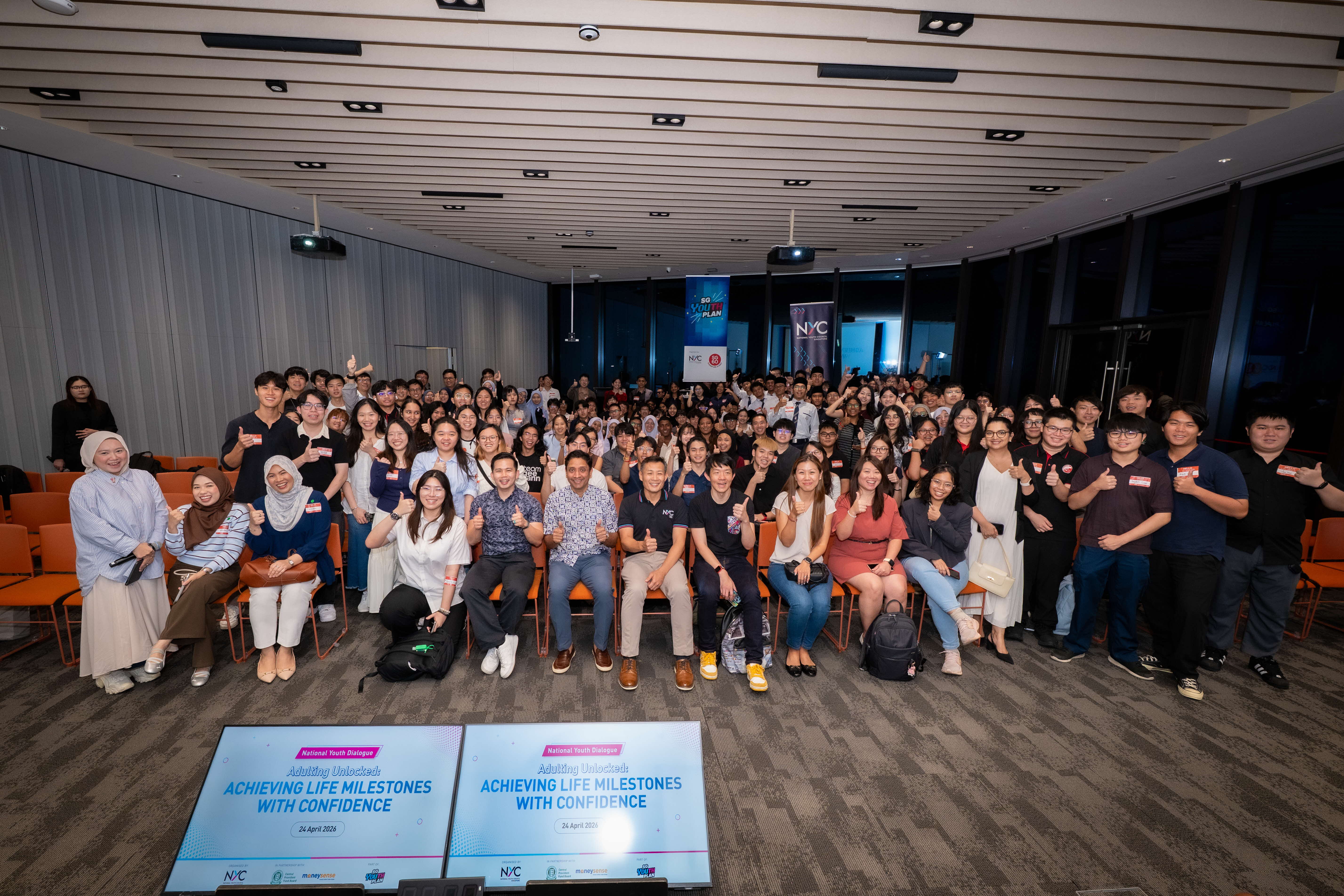 large group posing with achieving life milestones with confidence